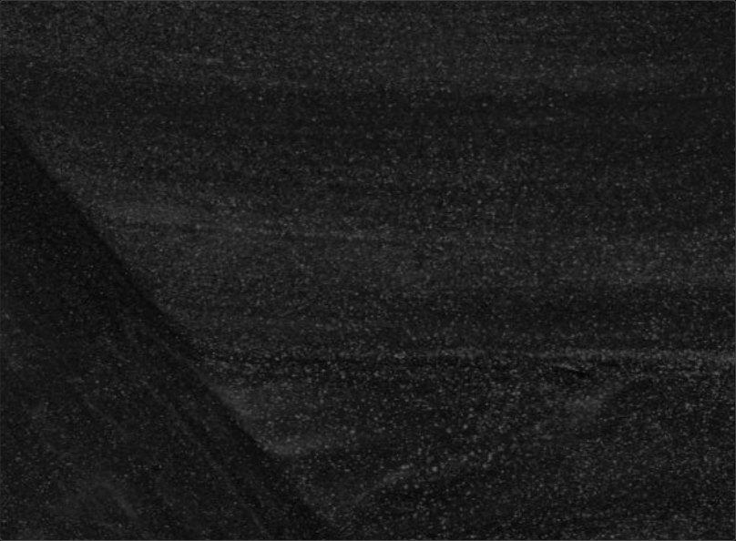 Dark grainy texture cut by a diagonal edge